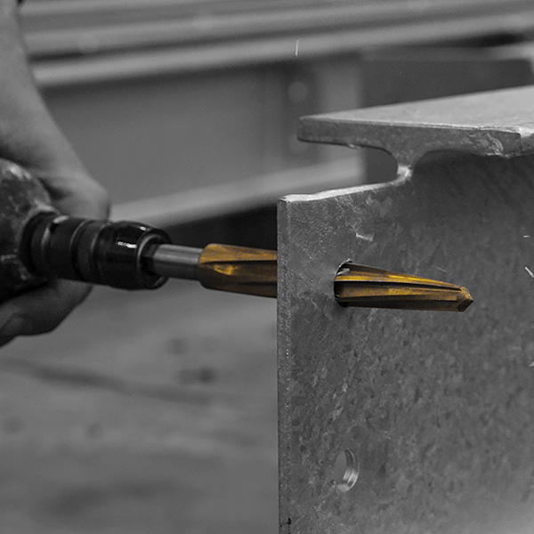 Enlarging existing holes for accurate steel erection: Tennent Steel